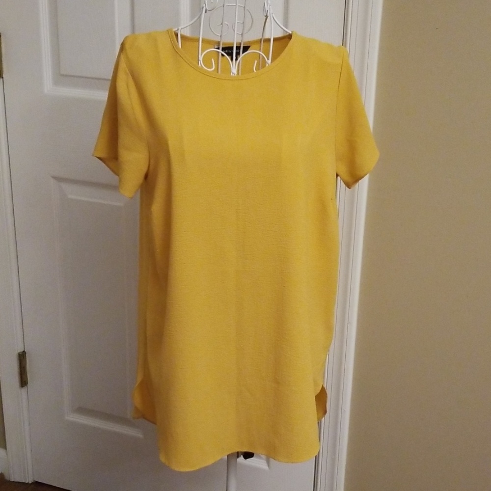Mustard yellow tunic.